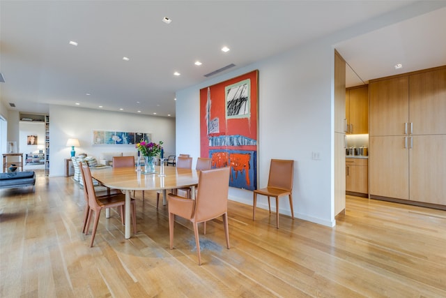 dining space featuring light wood-type flooring