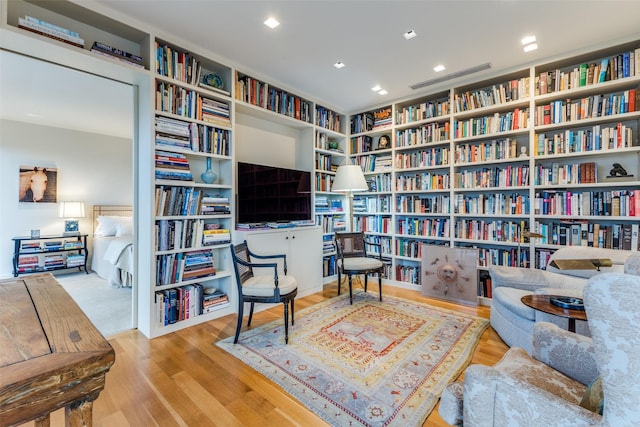 sitting room with light hardwood / wood-style flooring