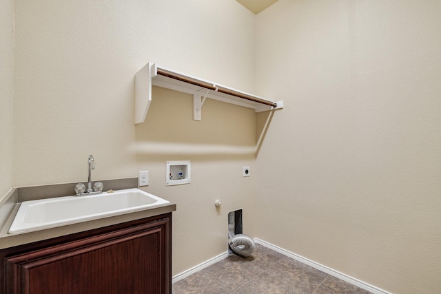 washroom with gas dryer hookup, cabinets, sink, washer hookup, and hookup for an electric dryer