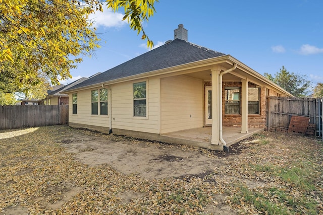 rear view of property with a patio area