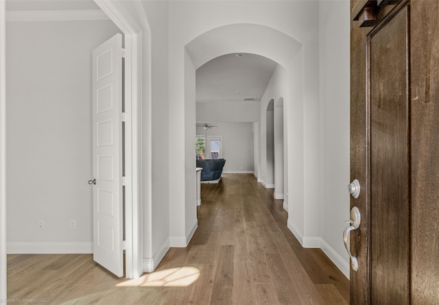 hallway with light hardwood / wood-style floors