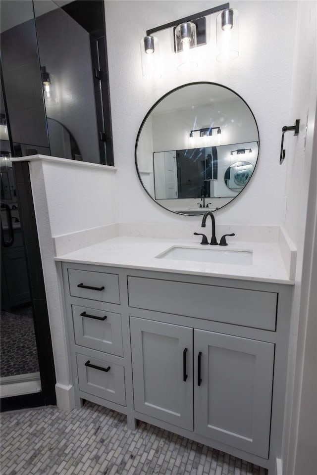 bathroom with tile patterned flooring and vanity