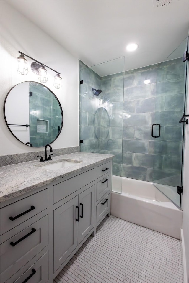 bathroom featuring shower / bath combination with glass door, vanity, and tile patterned floors