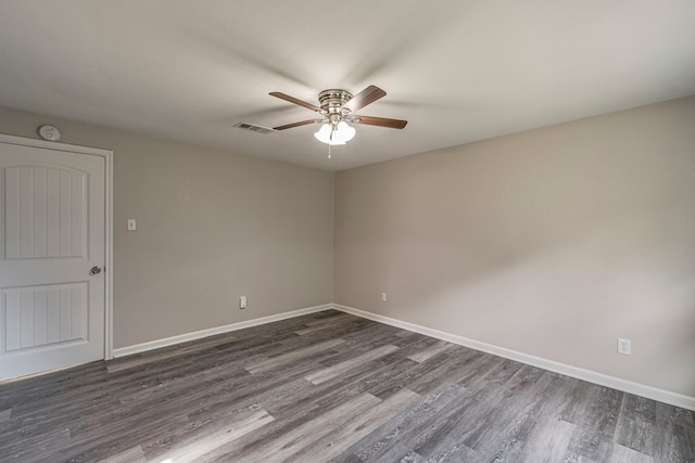 unfurnished room with dark hardwood / wood-style floors and ceiling fan