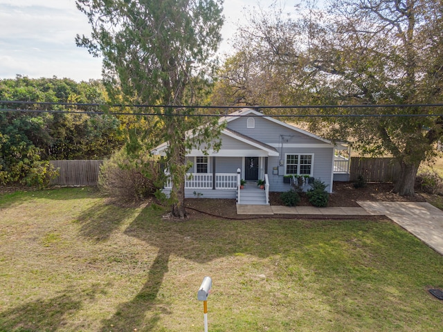 view of front of property with a porch and a front lawn