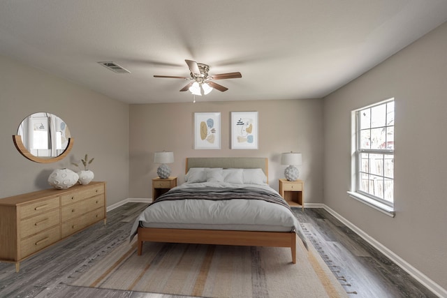 bedroom featuring ceiling fan and dark wood-type flooring