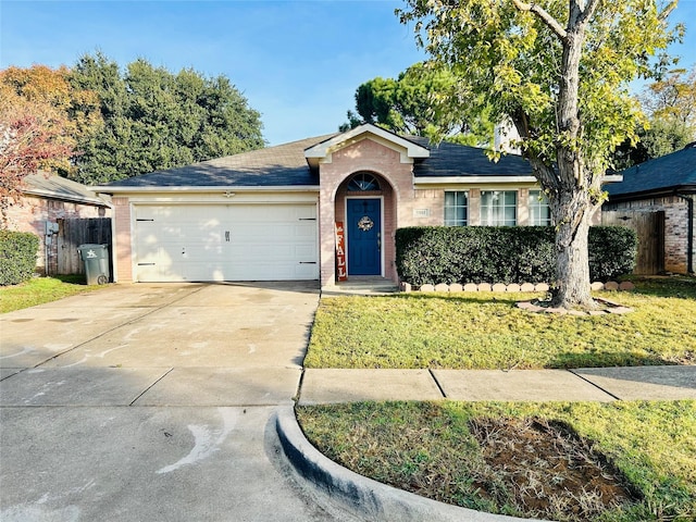 ranch-style house featuring a front yard and a garage