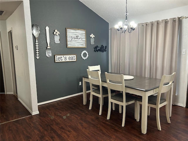 dining space with a chandelier, vaulted ceiling, and dark wood-type flooring