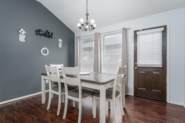 dining room with vaulted ceiling, a notable chandelier, and dark hardwood / wood-style flooring