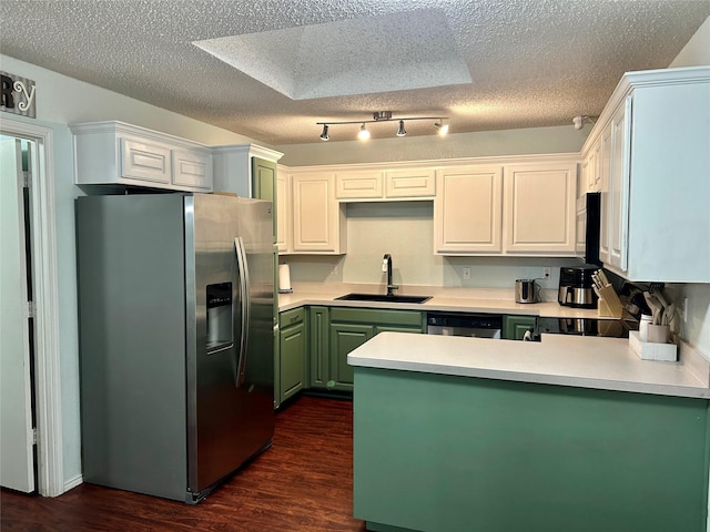 kitchen featuring white cabinetry, sink, dark hardwood / wood-style flooring, a textured ceiling, and appliances with stainless steel finishes