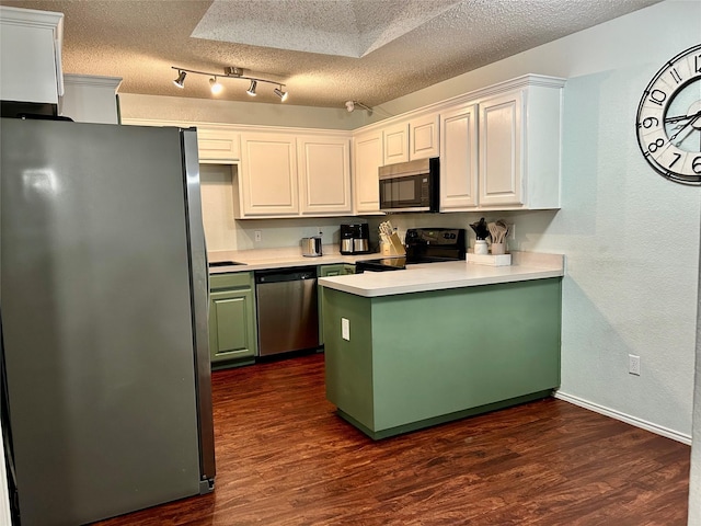 kitchen featuring white cabinets, dark hardwood / wood-style flooring, a textured ceiling, and appliances with stainless steel finishes