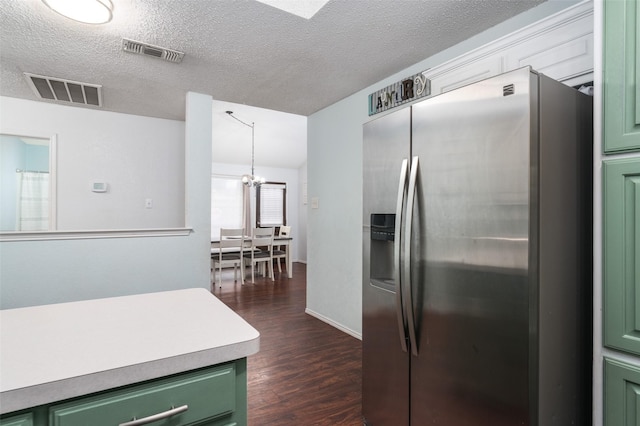 kitchen with stainless steel refrigerator with ice dispenser, green cabinetry, a textured ceiling, dark hardwood / wood-style flooring, and a notable chandelier