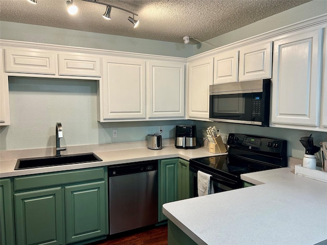 kitchen with sink, white cabinets, stainless steel appliances, and a textured ceiling