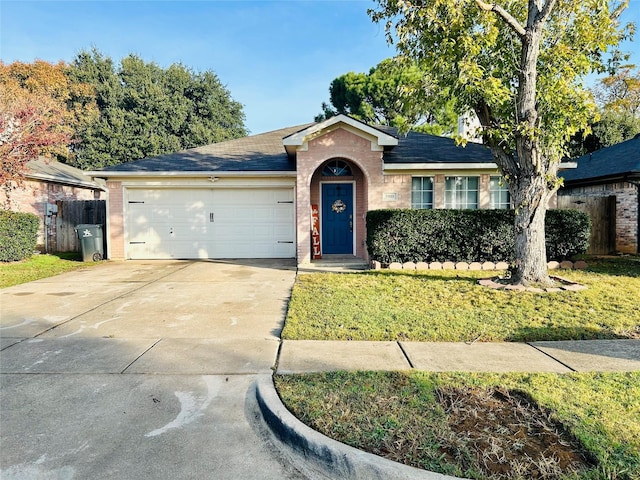 single story home featuring a front lawn and a garage