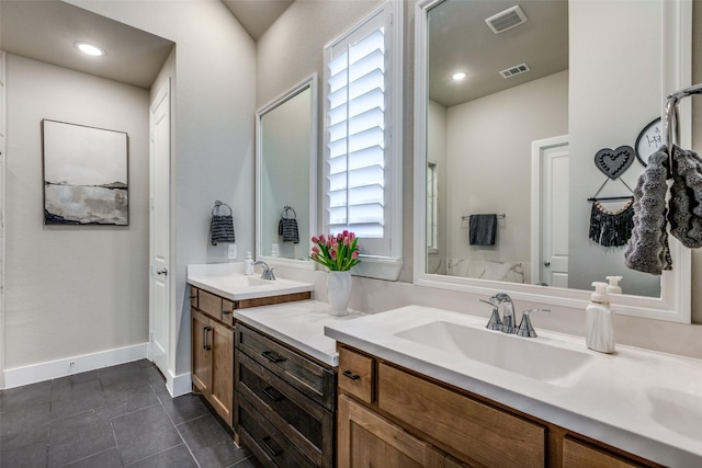 bathroom with tile patterned flooring and vanity