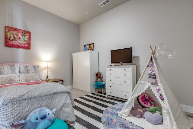 bedroom with light colored carpet