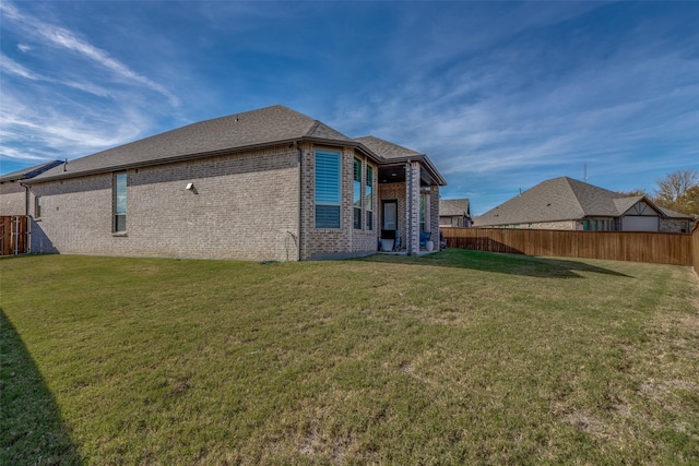 back of house with a yard