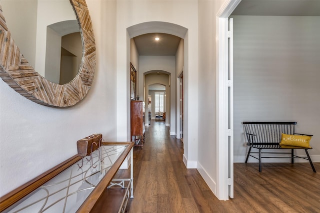 hall with dark hardwood / wood-style flooring