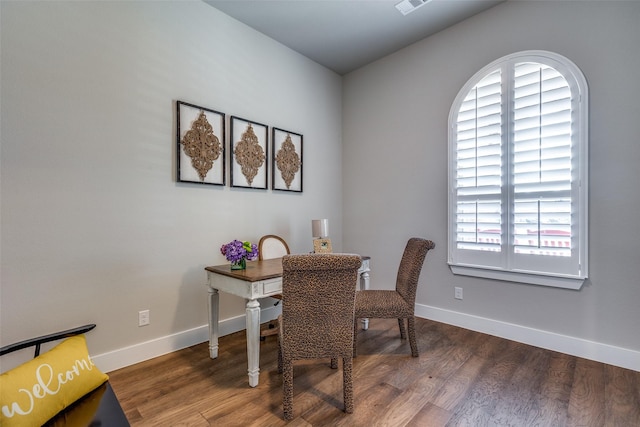 dining room with plenty of natural light and hardwood / wood-style floors