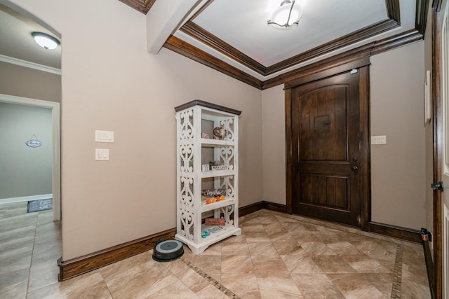 foyer entrance featuring ornamental molding