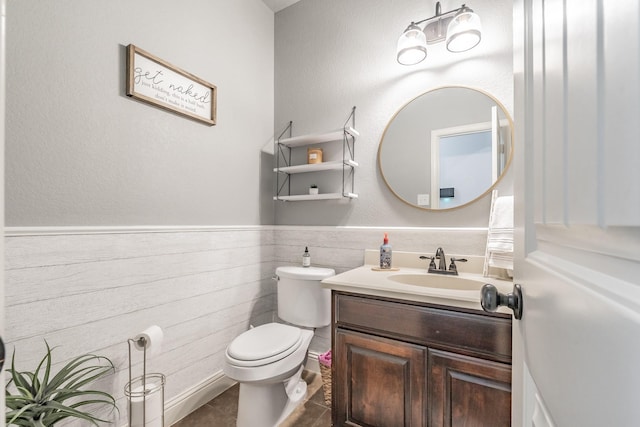 bathroom with tile patterned floors, vanity, and toilet