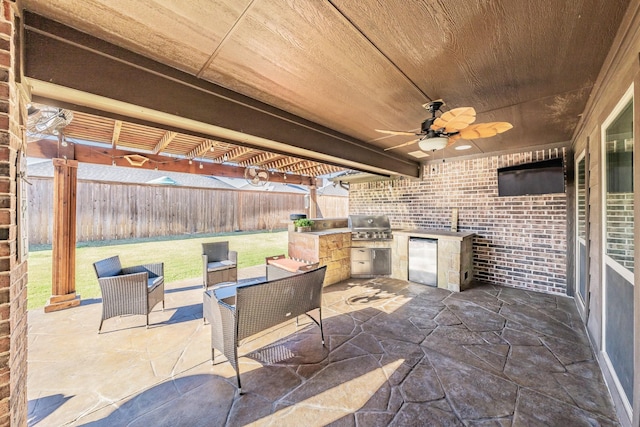 view of patio with a grill, area for grilling, and ceiling fan