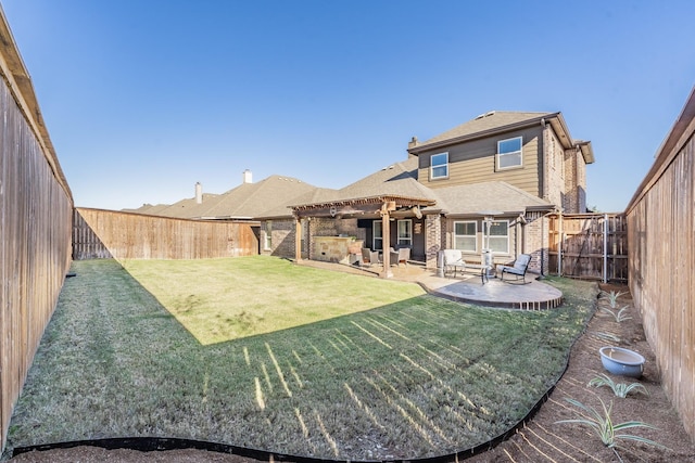 rear view of house featuring a lawn and a patio area