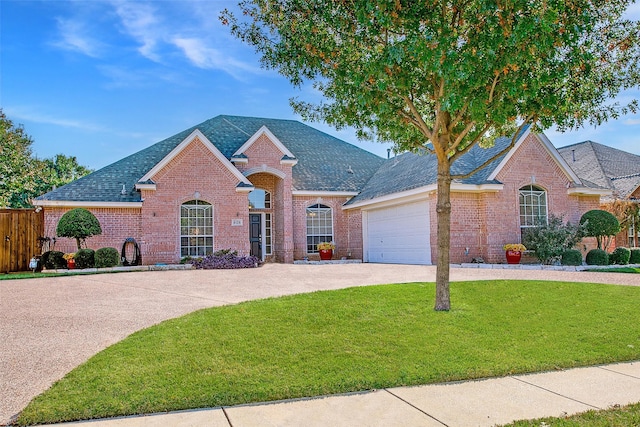 view of front facade with a garage and a front lawn