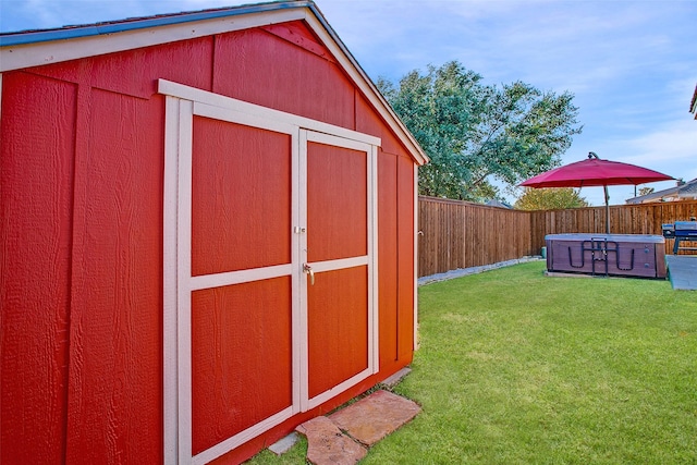 view of outdoor structure with a lawn