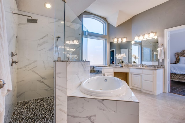 bathroom featuring vanity, lofted ceiling, and shower with separate bathtub