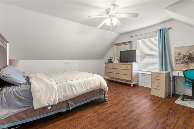 bedroom featuring dark wood-type flooring, ceiling fan, and vaulted ceiling