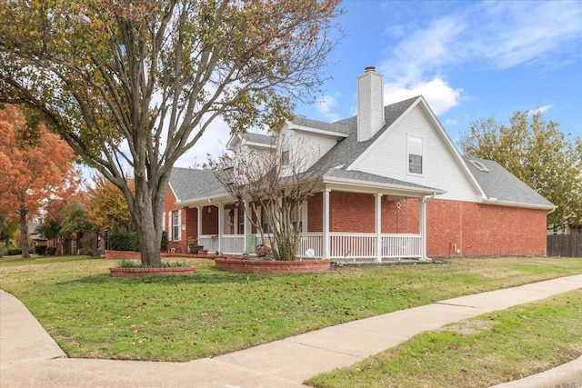 view of front facade with a porch and a front lawn