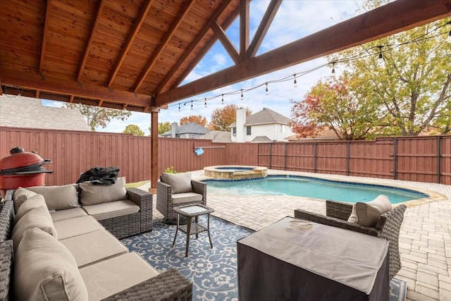 view of pool featuring a patio area, an outdoor hangout area, and an in ground hot tub