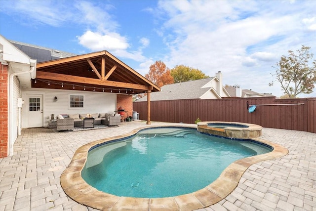 view of swimming pool featuring a patio area, an outdoor hangout area, and an in ground hot tub