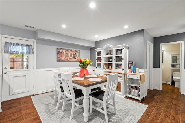 dining area featuring dark wood-type flooring