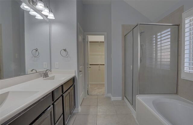 bathroom with shower with separate bathtub, tile patterned floors, and vanity