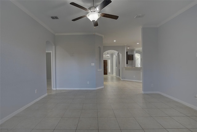 unfurnished room with ceiling fan, ornamental molding, and light tile patterned flooring