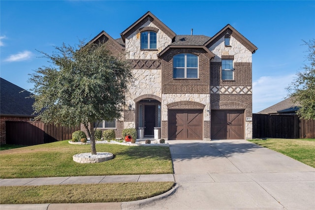 view of front facade with a front yard and a garage