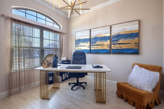 office featuring crown molding, an inviting chandelier, and light hardwood / wood-style flooring