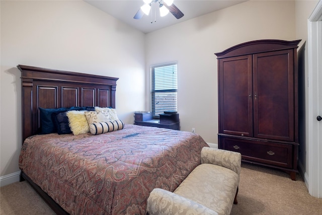 bedroom featuring ceiling fan and light carpet