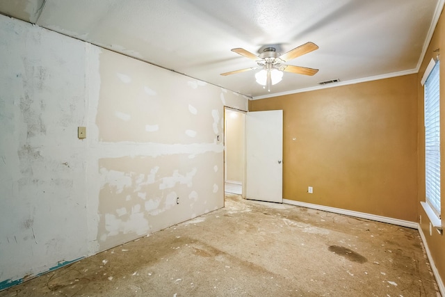 empty room featuring plenty of natural light, ornamental molding, and ceiling fan