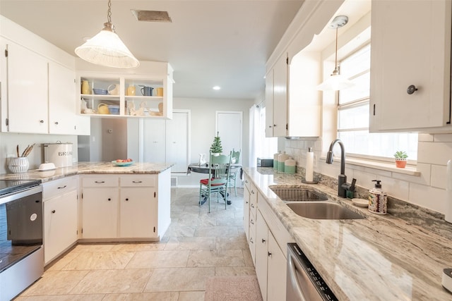 kitchen with sink, white cabinetry, hanging light fixtures, and stainless steel appliances