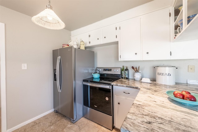 kitchen featuring white cabinets, pendant lighting, light tile patterned floors, and appliances with stainless steel finishes