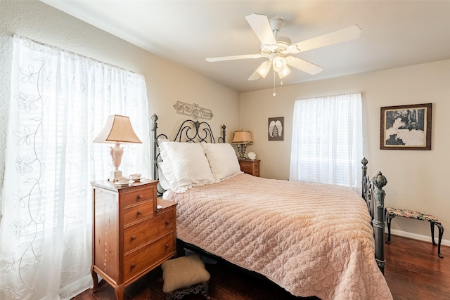 bedroom featuring dark hardwood / wood-style flooring and ceiling fan