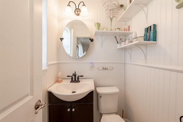 bathroom featuring vanity and toilet