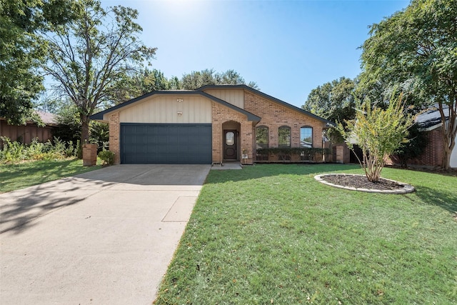 view of front of home with a garage and a front lawn