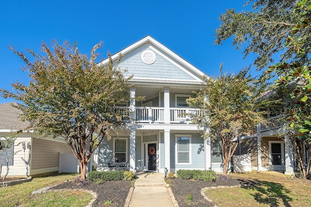 view of front of house featuring a balcony