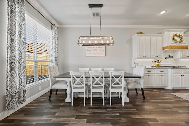 dining space with visible vents, dark wood finished floors, an inviting chandelier, recessed lighting, and ornamental molding