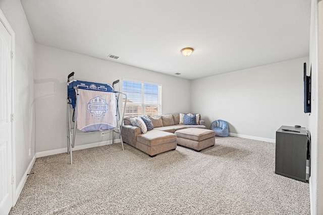 living room with baseboards, carpet floors, and visible vents