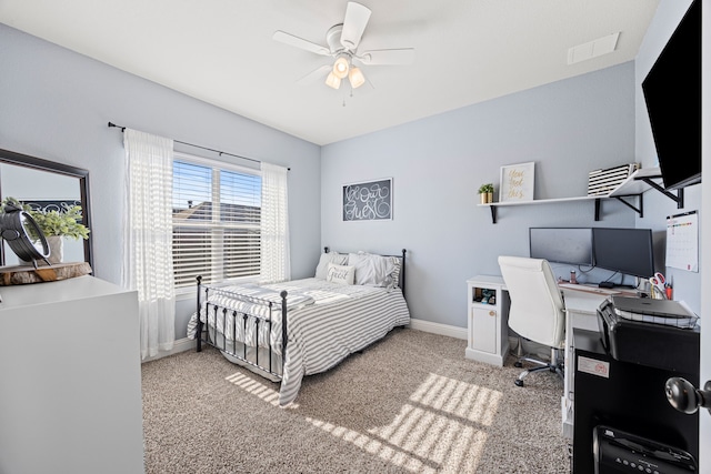 carpeted bedroom featuring visible vents, baseboards, and a ceiling fan